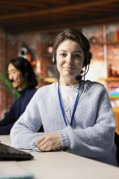 Close up of customer support worker wearing headset following call script 写真素材