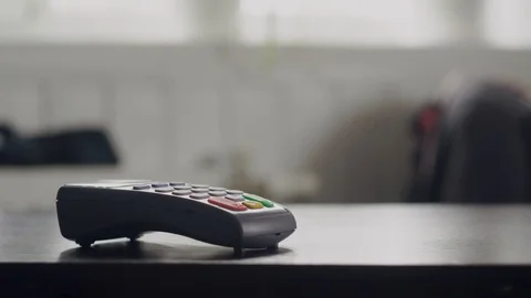 Close-up customer uses smartphone to make a wireless payment with password Stock Footage 114668463