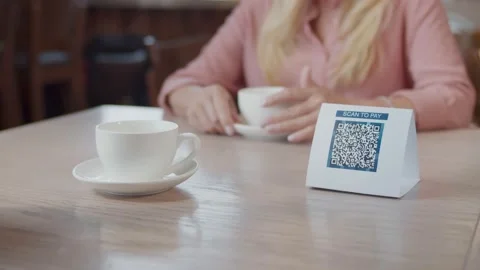 Close up of customer using digital mobile phone scan QR code paying for buying Stock Footage 135225042