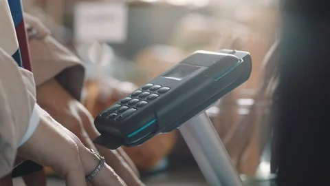 Close up customer using smart watch making contactless payment mobile money Video stock 103478989