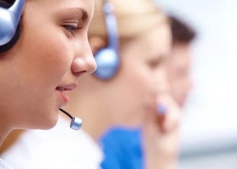 Close-up of customers representative with headset in line during work Stock Photos