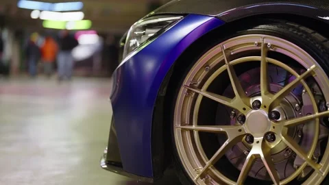 Close up of a customized luxury car wheel Stock Footage 343550646