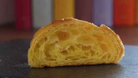 Close-up of the cut half of a fresh croissant 스톡 동영상 168175191