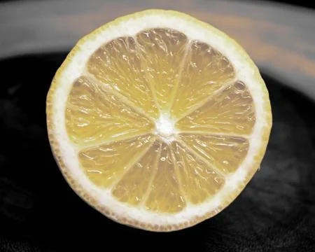 Close up of a cut lemon - refreshing fruit and cocktail bar garnish Stock Photos