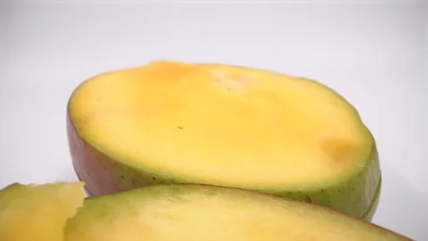 Close up of cut mango on white background Stock Footage 328428465