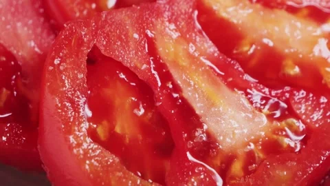 Close up of cut red tomato. Texture of juicy red fresh tomato. Stock Footage 309795890