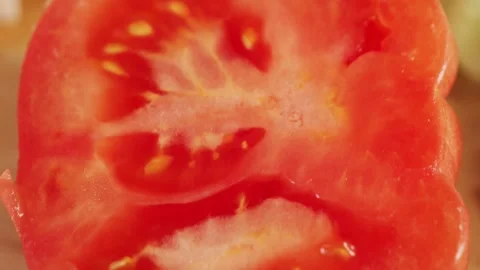 Close up of cut red tomato. Texture of juicy red fresh tomato. 스톡 동영상 335140603