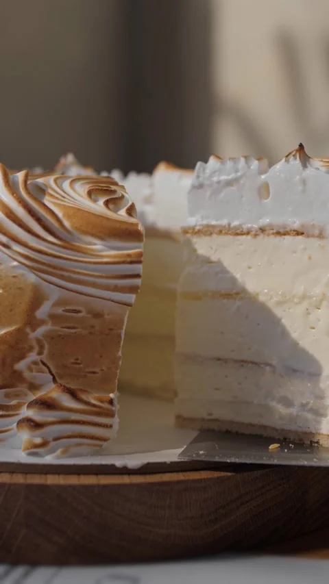 A close-up of a cut slice of a birthday cake with white cream Stock Footage 310500463