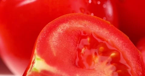 Close-up of a cut tomato. fresh vegetables with water drops. veggie food. Stock Footage 246367096