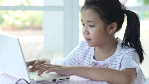 Close up of cute Asian girl using laptop  slow motion Stock Footage 79207730