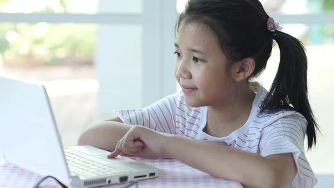 Close up of cute Asian girl using laptop  slow motion Stock Footage 79208588