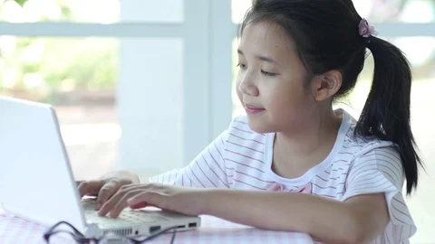 Close up of cute Asian girl using laptop  Stock Footage 79211706