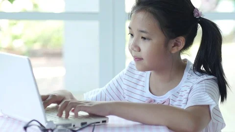 Close up of cute Asian girl using laptop Stock Footage 79254490