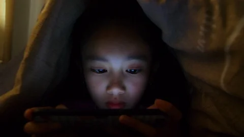 Close up of cute asian girl using smartphone ,Young teenage boy playing games on Stock Footage 105784792