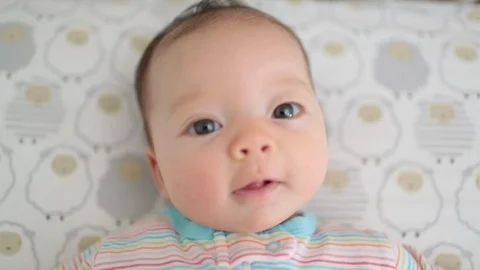 Close Up Cute Baby Looking at Camera Stock Footage 91099599