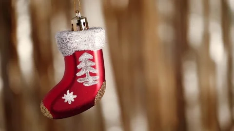 Close up cute Christmas tree bauble in form of red Santa Claus stocking. Stock Footage 258625993