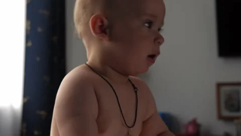 Close-up Cute Nake diaper Kid 10 Month Newborn Boy Looking At Camera crawling Vídeos de archivo 197638654