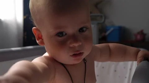 Close-up Cute Nake diaper Kid 10 Month Newborn Boy Looking At Camera crawling Vídeos de archivo 199283289