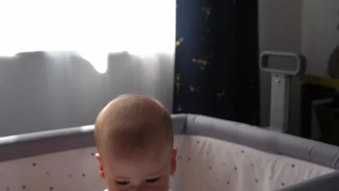 Close-up Cute Nake diaper Kid 10 Month Newborn Boy Looking At Camera crawling Vídeos de archivo 199467224
