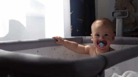 Close-up Cute Nake diaper Kid 10 Month Newborn Boy Looking At Camera crawling Stock Footage 199467583