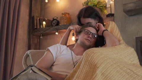 Close Up Cute Young Couple Hugging Sitting On A Chair Stock Footage 138017500