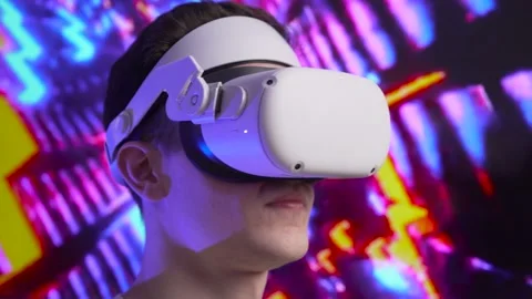 Close up cute young man uses interactive VR headset, amaze and enjoys virtual Stock Footage 166442940