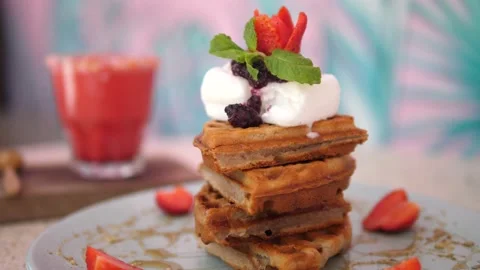 Close up of cutted stack of waffles with pink smoothie on the background Stock Footage 150435262