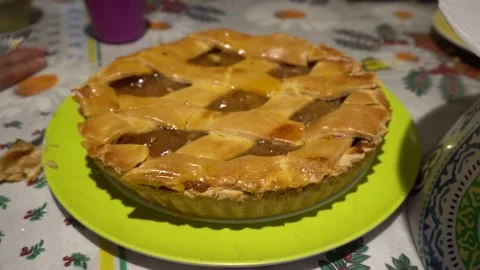 Close up cutting an apple pie with a knife on a birthday Stock Footage 148771353