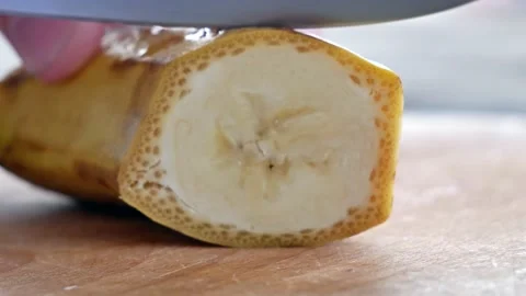 Close Up Of Cutting Banana To A Slices Stock Footage 133137579