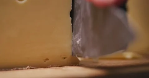 Close Up Cutting of Cheese Wheel in Slow Motion Video stock 274774328