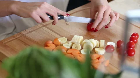 Close-up of cutting cherry tomatoes Stock Footage 59541506