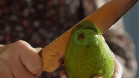 Close Up of Cutting Fresh Avocado with Kitchen Knife Stock Footage 336466794
