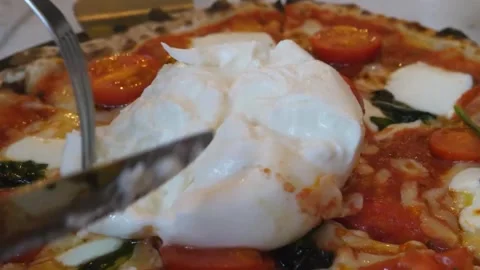 Close-up of Cutting Fresh Burrata Cheese on Authentic Italian Pizza Stock Footage 337679009