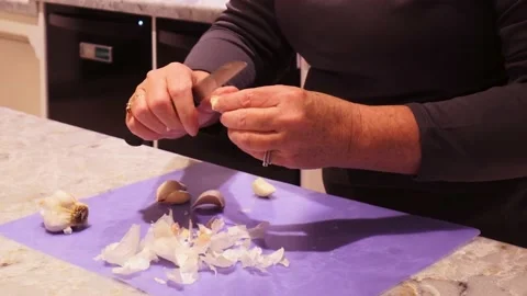 Close up cutting garlic Stock Footage 135950484