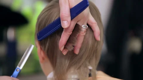 Close-up of cutting hair. Stock Footage 49396818