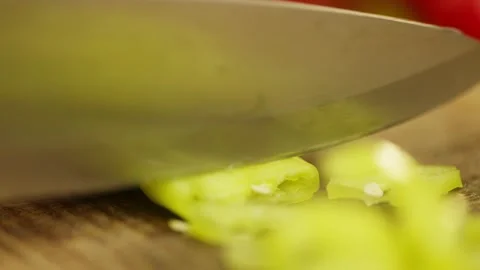 Close-up of cutting a hot green pepper with a large knife. Stock Footage 296363174