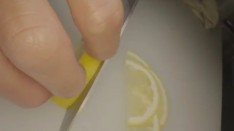 Close up cutting into lemon slices Stock Footage 336658099