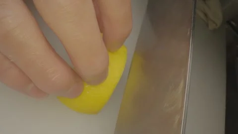 Close up cutting into lemon slices Stock Footage 336658107