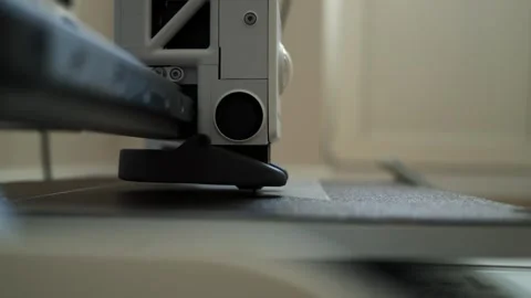 Close-up of a cutting machine precisely slicing through material with a blade Stock Footage 339186137