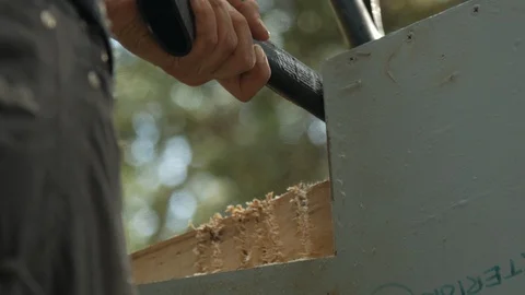 Close up of cutting notches in log with axe and hammer, 4k Stock Footage 120314535