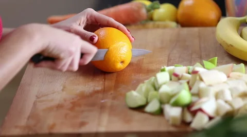 Close-up of cutting orange with knife Stock Footage 59540708