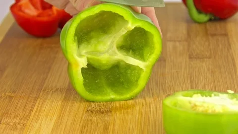 Close-up of cutting a piece from green pepper Stock-Footage 83629826