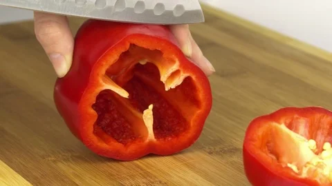 Close-up of cutting a piece from red pepper Stock-Footage 83629350