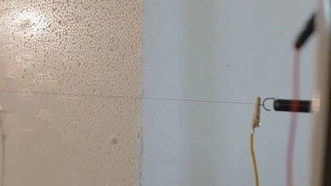 Close up: Cutting plastic foam. Automatic cutting of expanded polystyrene (foam Stock Footage 130018644