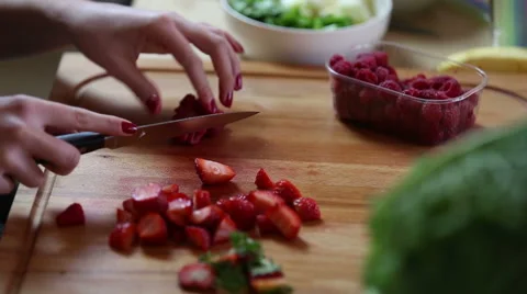 Close-up of cutting raspberries Stock Footage 59541669