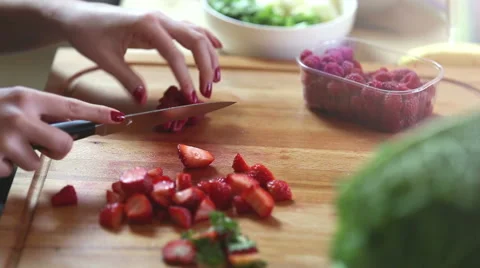 Close-up of cutting raspberries Stock Footage 59541673