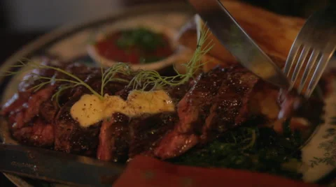 A close up of cutting a steak in a restaurant Stockbeeldmateriaal 42428878