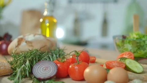 Close up cutting table with fresh green ingridients at the kitchen Stock Footage 107557981
