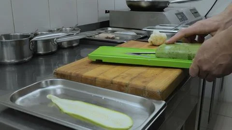 Close-up of cutting vegetables in a restaurant kitchen. Chef cooking in Stock Photos