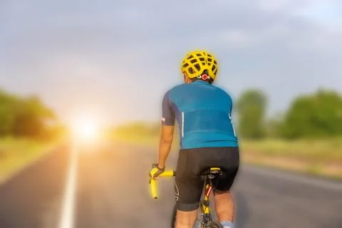 Close up of Cyclist man with clipping path over blurred morning background Фото